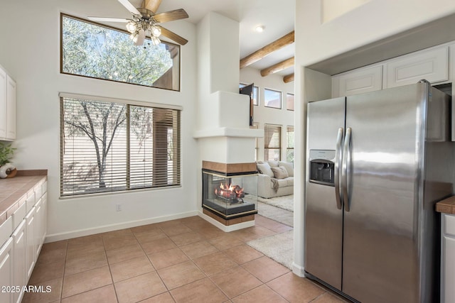 13680 E Paradise Dr, Scottsdale, AZ 85259 - kitchen with plenty of natural light, white cabinets, and stainless steel refrigerator with ice dispenser
