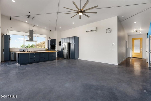 kitchen with a ceiling fan, concrete flooring, stainless steel appliances, and extractor fan