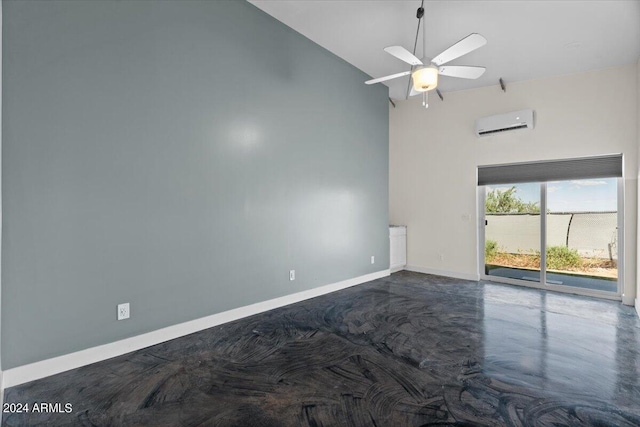 empty room with baseboards, high vaulted ceiling, an AC wall unit, and a ceiling fan