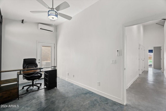 office area with baseboards, ceiling fan, concrete floors, and an AC wall unit