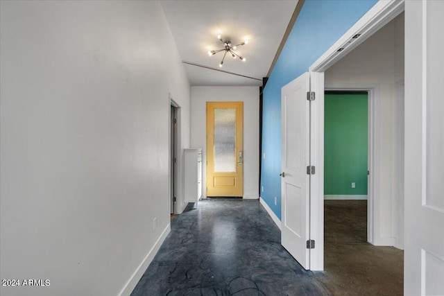 hallway with lofted ceiling