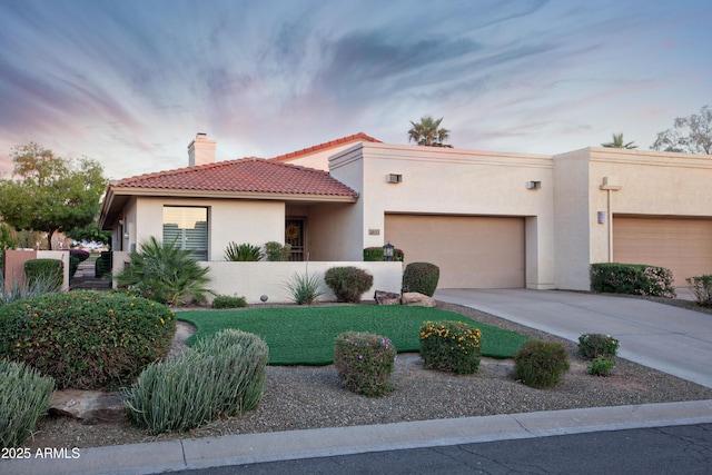 2635 N 62nd St, Mesa, AZ 85215 - view of front of home featuring a tiled roof, a garage, stucco siding, a chimney, and concrete driveway