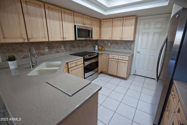 2635 N 62nd St, Mesa, AZ 85215 - kitchen with light tile patterned floors, a sink, light brown cabinetry, stainless steel appliances, and backsplash