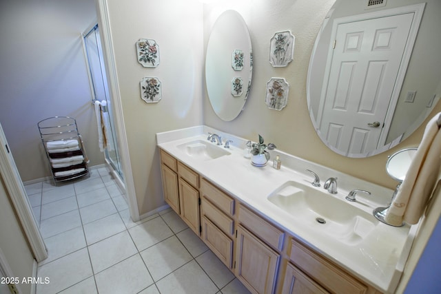 2635 N 62nd St, Mesa, AZ 85215 - full bath featuring a sink, tile patterned floors, double vanity, and a stall shower