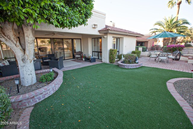 2635 N 62nd St, Mesa, AZ 85215 - rear view of property with stucco siding, a chimney, a patio area, a tile roof, and a yard