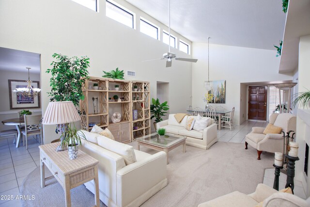 2635 N 62nd St, Mesa, AZ 85215 - living area with ceiling fan with notable chandelier, a towering ceiling, tile patterned flooring, and visible vents