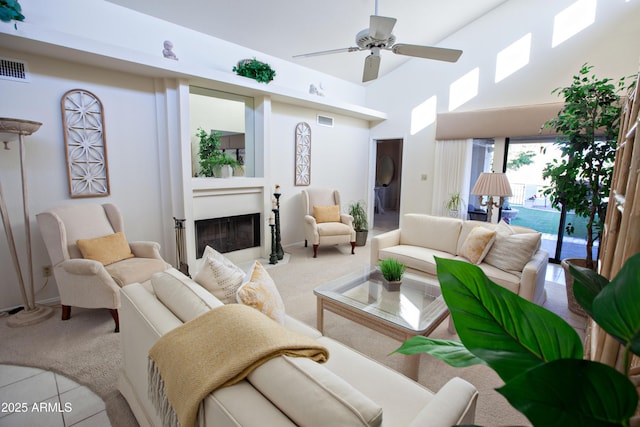 2635 N 62nd St, Mesa, AZ 85215 - living area featuring a high ceiling, light colored carpet, a fireplace, and visible vents