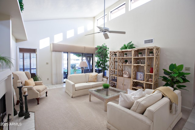 2635 N 62nd St, Mesa, AZ 85215 - carpeted living room featuring visible vents, a high ceiling, and a ceiling fan