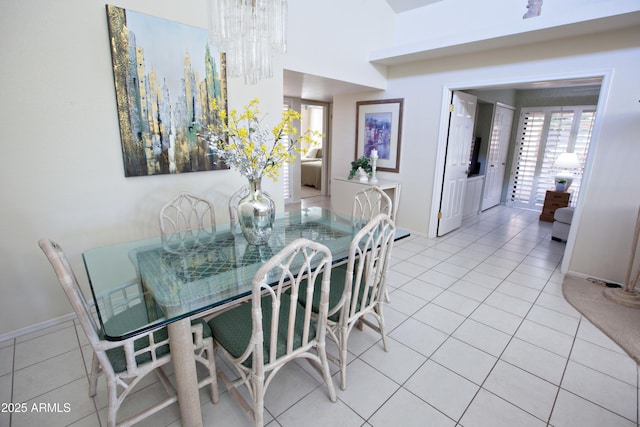 2635 N 62nd St, Mesa, AZ 85215 - dining space with a chandelier, light tile patterned floors, and baseboards