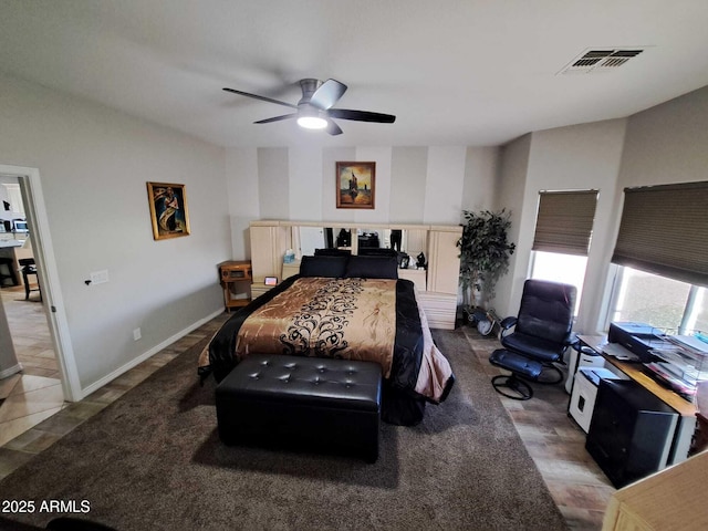 bedroom with tile patterned floors and ceiling fan