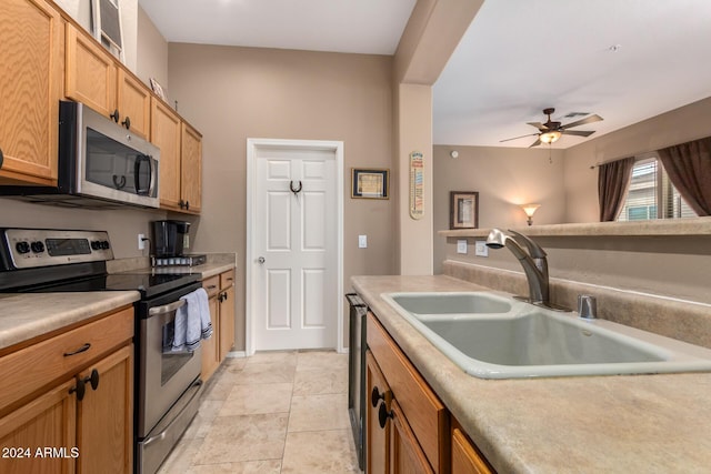 kitchen with ceiling fan, light tile patterned floors, sink, and appliances with stainless steel finishes