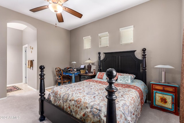 bedroom featuring ceiling fan and light carpet