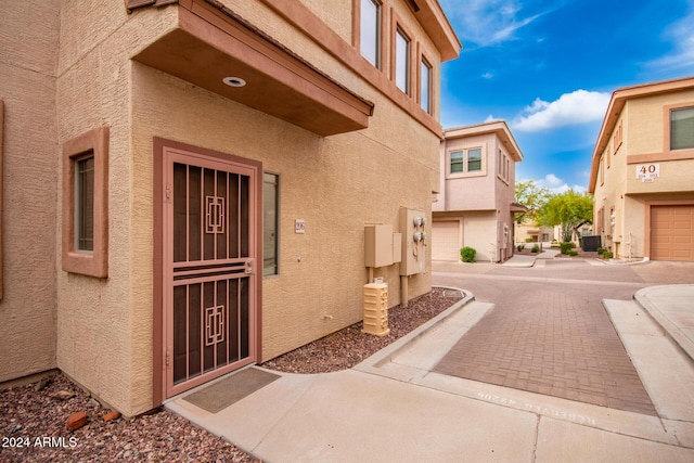 doorway to property with central AC unit