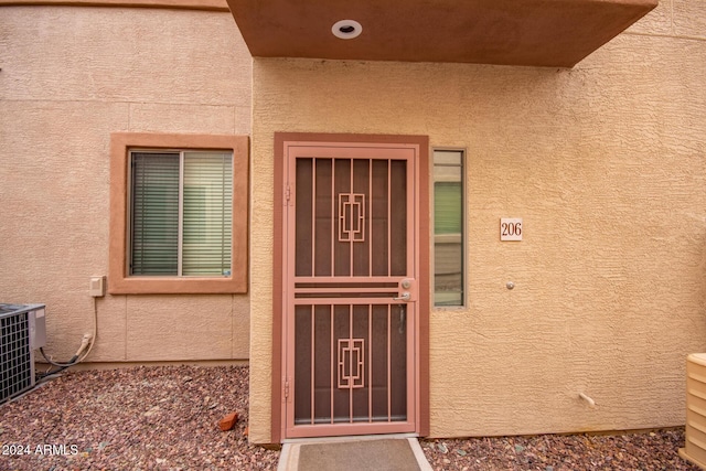 doorway to property with central AC