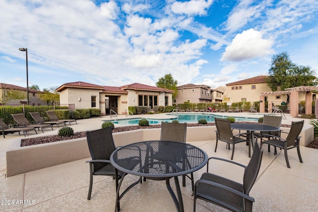 view of swimming pool with a patio