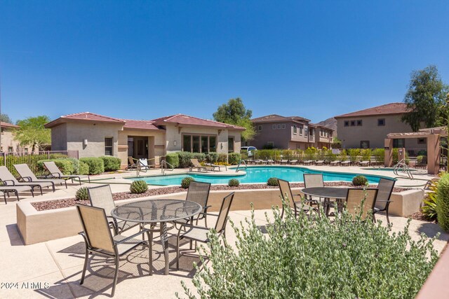 view of pool featuring a patio