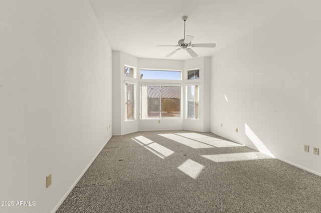 empty room with carpet floors and ceiling fan