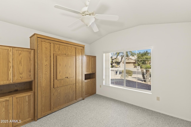 bedroom featuring vaulted ceiling, ceiling fan, and light carpet