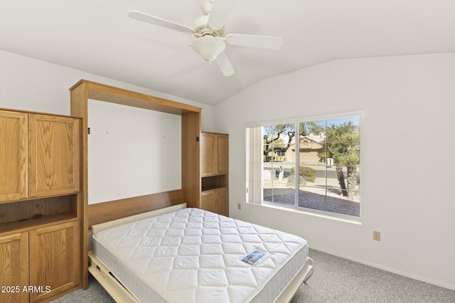 bedroom with vaulted ceiling, carpet floors, and ceiling fan