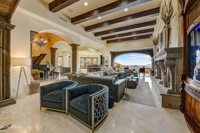 living room with arched walkways, decorative columns, light tile patterned floors, visible vents, and beamed ceiling