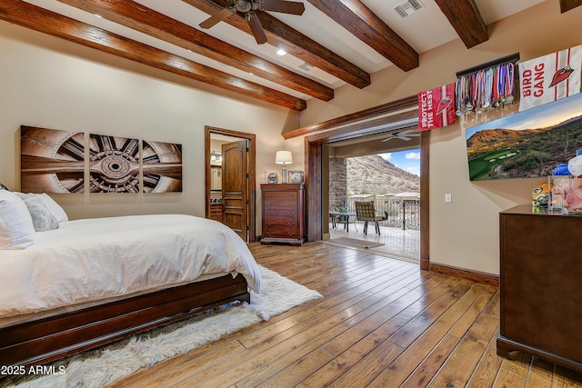 bedroom featuring access to exterior, visible vents, beamed ceiling, baseboards, and hardwood / wood-style flooring