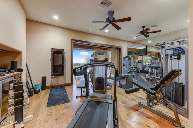 exercise area with recessed lighting, visible vents, and wood finished floors