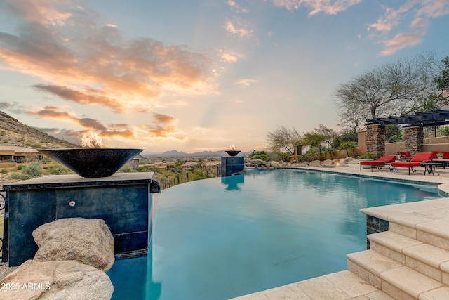 view of swimming pool with a fenced in pool, a patio, and a mountain view