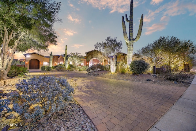 view of front of property featuring decorative driveway