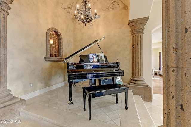 living area featuring decorative columns, stairway, baseboards, and tile patterned floors