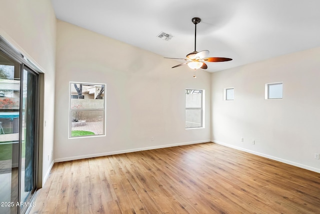 unfurnished room with vaulted ceiling, ceiling fan, and light hardwood / wood-style floors