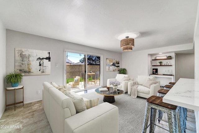 living area featuring baseboards