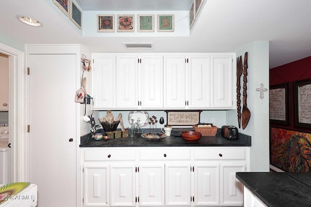 4317 N 70th St, Scottsdale, AZ 85251 - kitchen featuring dark countertops and white cabinets