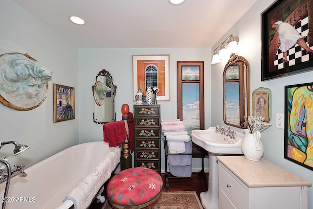 4317 N 70th St, Scottsdale, AZ 85251 - full bathroom with a freestanding bath, a sink, wood finished floors, and recessed lighting