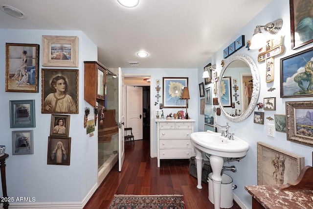 4317 N 70th St, Scottsdale, AZ 85251 - bathroom with a stall shower, wood finished floors, and baseboards
