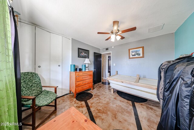 bedroom featuring a ceiling fan, a closet, and visible vents