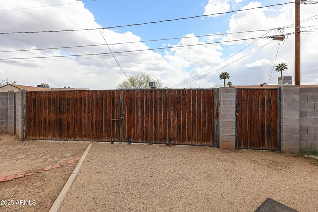 exterior space featuring a gate and fence