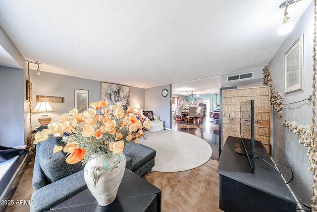 living room featuring visible vents