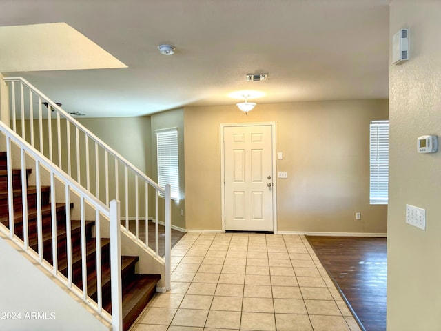 foyer featuring plenty of natural light and light hardwood / wood-style flooring