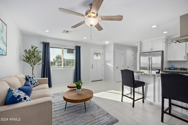 living room with ceiling fan