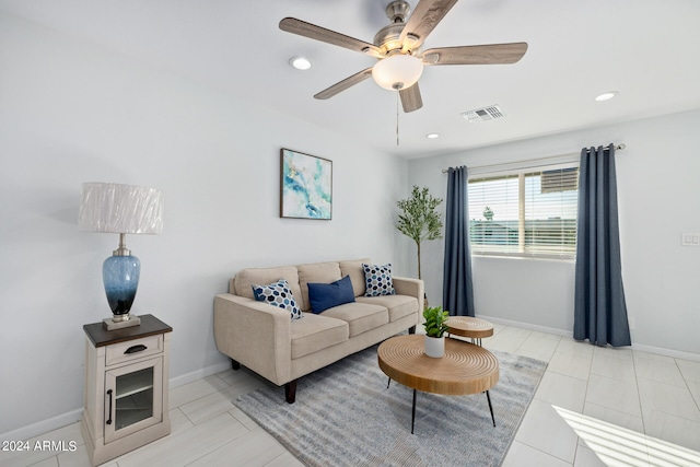 living room featuring ceiling fan and light tile floors