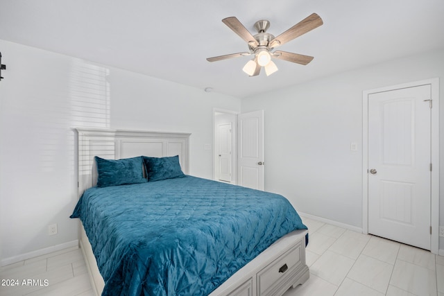 tiled bedroom with ceiling fan