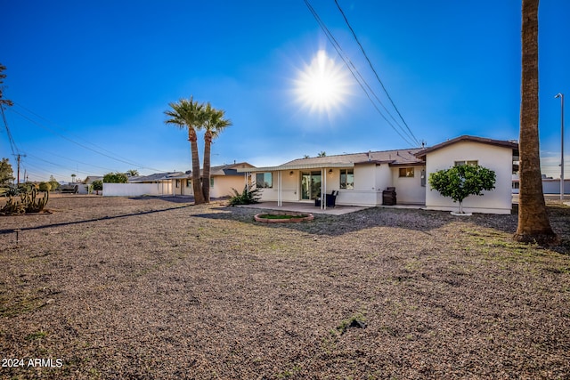 back of property with a patio area