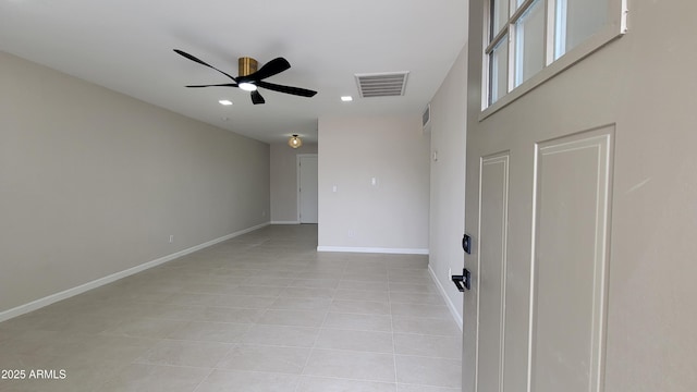 empty room featuring light tile patterned flooring, a ceiling fan, baseboards, and recessed lighting