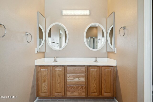 bathroom featuring double vanity and a sink