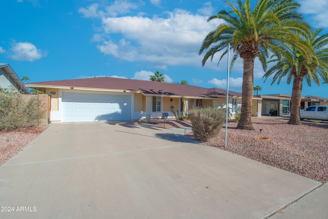 ranch-style house featuring a garage