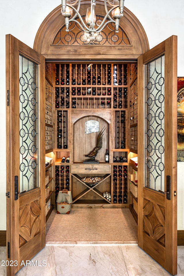 wine room with a chandelier