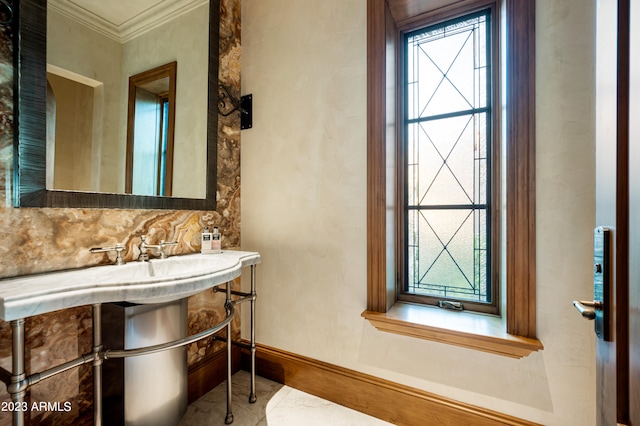 bathroom with ornamental molding and decorative backsplash