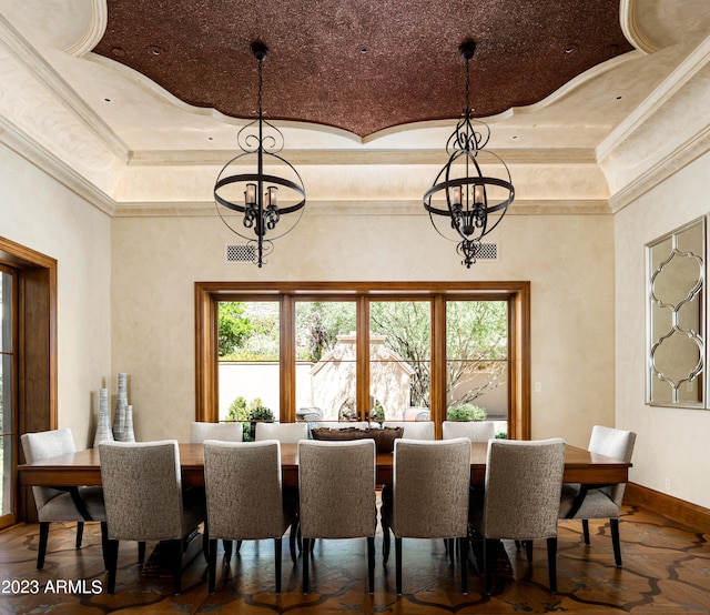 dining area featuring crown molding, a notable chandelier, a tray ceiling, and wood-type flooring