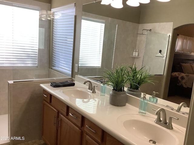 553 W Hereford Dr, San Tan Valley, AZ 85143 - bathroom featuring a shower, a sink, and a healthy amount of sunlight
