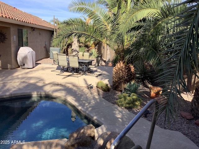553 W Hereford Dr, San Tan Valley, AZ 85143 - view of pool with a grill, a patio area, outdoor dining area, and a pool